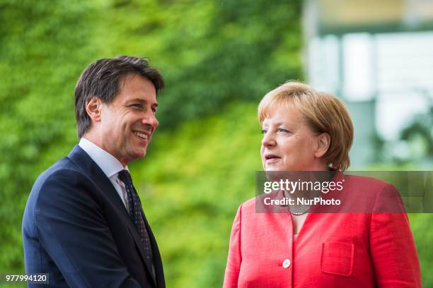 German Chancellor Angela Merkel greets Italian Prime Minister Giuseppe Conte upon his arrival at the Chancellery in Berlin, Germany on June 18, 2018.