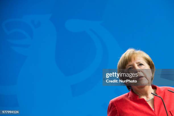 German Chancellor Angela Merkel is pictured as she gives a statement to the press before her meeting at the Chancellery with Italian Prime Minister...