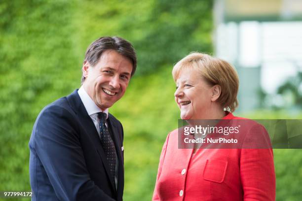 German Chancellor Angela Merkel greets Italian Prime Minister Giuseppe Conte upon his arrival at the Chancellery in Berlin, Germany on June 18, 2018.