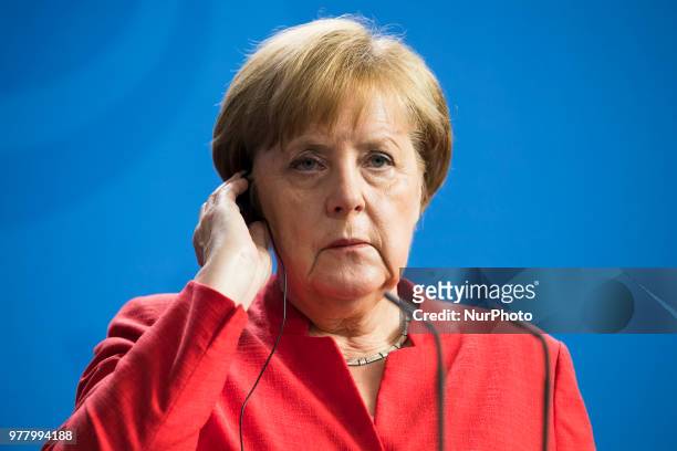 German Chancellor Angela Merkel is pictured as she gives a statement to the press before her meeting at the Chancellery with Italian Prime Minister...