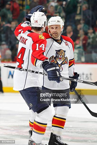 Cory Stillman is congratulated by his Florida Panthers teammate Radek Dvorak after scoring the game winning shootout goal against the Minnesota Wild...