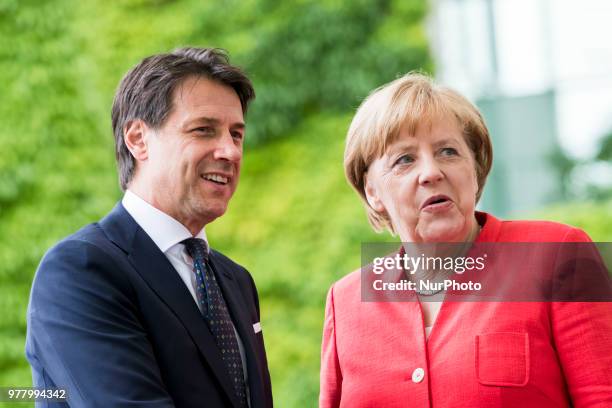 German Chancellor Angela Merkel greets Italian Prime Minister Giuseppe Conte upon his arrival at the Chancellery in Berlin, Germany on June 18, 2018.