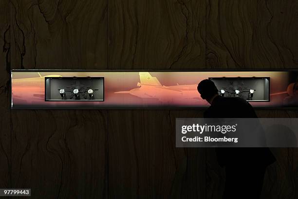 Visitor looks at watches at the Breitling stand at the Baselworld watch fair in Basel, Switzerland, on Wednesday, March 17, 2010. The Baselworld...