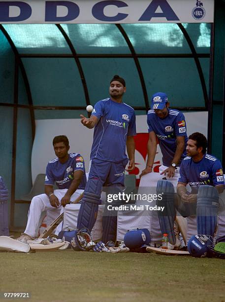 Sachin Tendulkar and Harbhajan Singh with other team members practice for the upcoming Mumbai Indians match against Delhi Daredevils in New Delhi on...