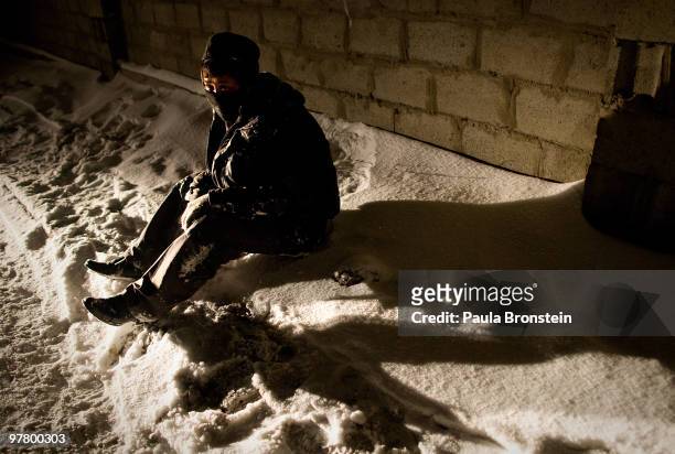 Drunk man passed out on the snow after being rejected from a homeless shelter March 16, 2010 in Ulaan Baatar, Mongolia. Mongolia suffers with a very...