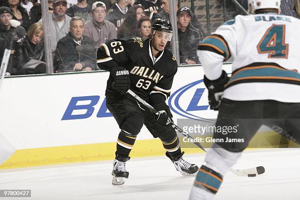 Mike Ribeiro of the Dallas Stars looks to pass to a teammate against Rob Blake of the San Jose Sharks on March 16, 2010 at the American Airlines...