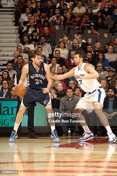 Marc Gasol of the Memphis Grizzlies handles the ball against Andrea Bargnani of the Toronto Raptors during the game on February 17, 2010 at Air...