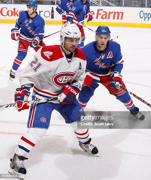 Brian Gionta of the Montreal Canadiens skates against Ryan Callahan of the New York Rangers on March 16, 2010 at Madison Square Garden in New York...