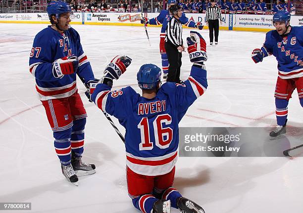 Sean Avery of the New York Rangers and teammates Chris Drury and Matt Gilroy celebrate Avery's second period goal against the Montreal Canadiens on...