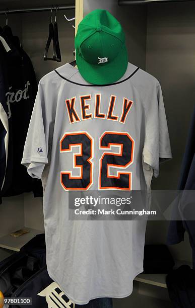 Don Kelly of the Detroit Tigers jersey and green hat to honor St. Patricks Day hang in his locker before the spring training game against the...