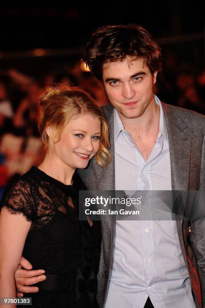 Actors Emilie de Ravin and Robert Pattinson attend the 'Remember Me' UK film premiere held at the Odeon Leicester Square on March 17, 2010 in London,...