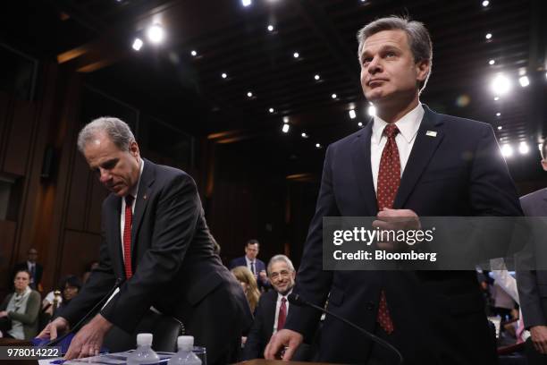 Michael Horowitz, inspector general with the U.S. Department of Justice , left, and Christopher Wray, director of the Federal Bureau of Investigation...