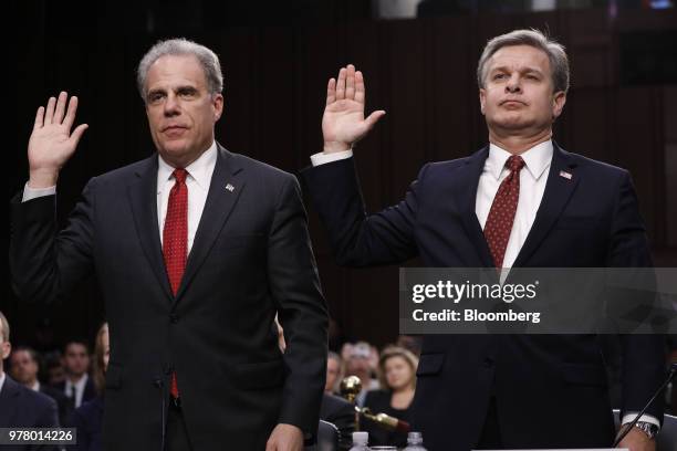 Michael Horowitz, inspector general with the U.S. Department of Justice , left, and Christopher Wray, director of the Federal Bureau of Investigation...