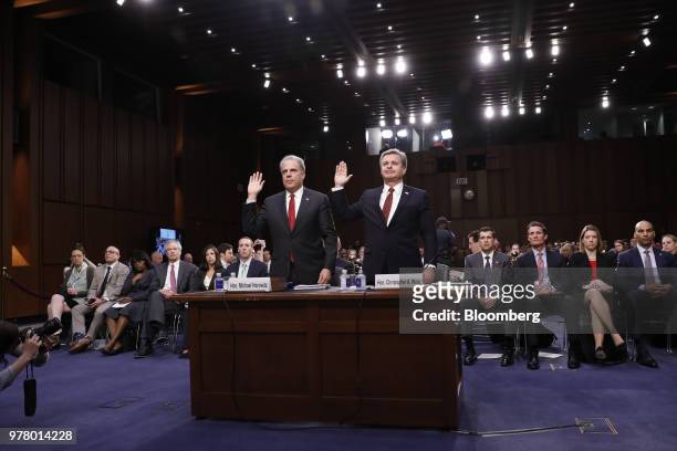 Michael Horowitz, inspector general with the U.S. Department of Justice , left, and Christopher Wray, director of the Federal Bureau of Investigation...