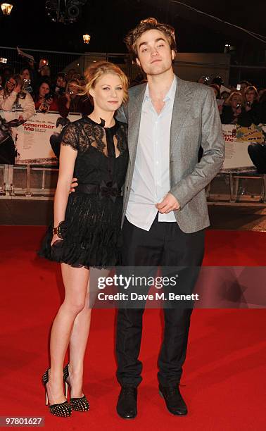 Emilie de Ravin and Robert Pattinson attend the 'Remember Me' UK film premiere at the Odeon Leicester Square on March 17, 2010 in London, England.