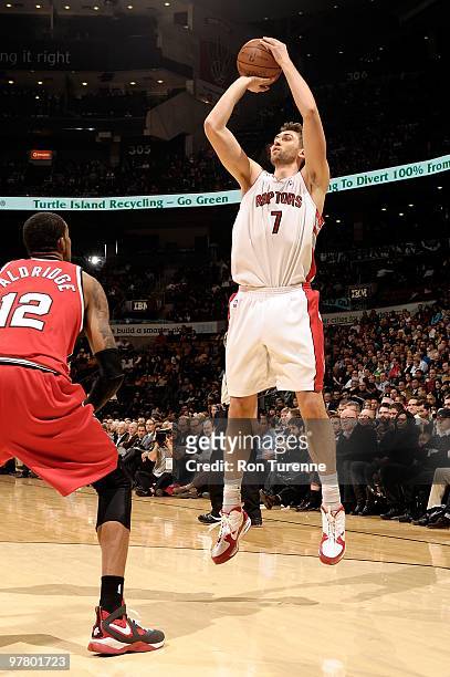 Andrea Bargnani of the Toronto Raptors shoots against LaMarcus Aldridge of the Portland Trail Blazers during the game on February 24, 2010 at Air...