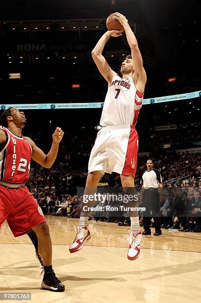 Andrea Bargnani of the Toronto Raptors shoots against Andre Miller of the Portland Trail Blazers during the game on February 24, 2010 at Air Canada...