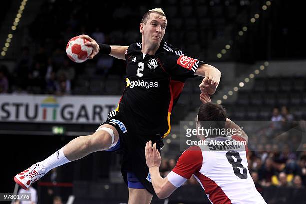 Pascal Hens of Germany is challenged by Andy Schmid of Switzerland during the international handball friendly match between Germany and Switzerland...