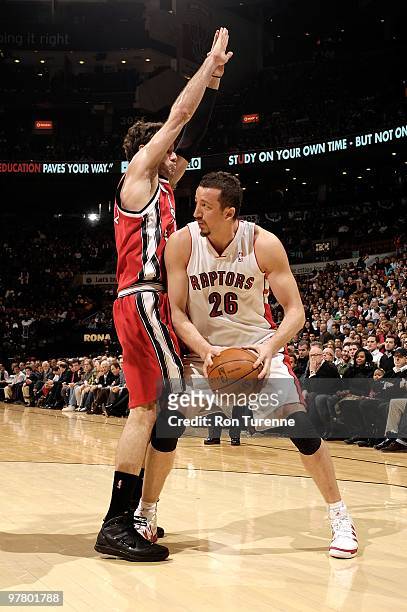 Hedo Turkoglu of the Toronto Raptors handles the ball against Jose Calderon of the Portland Trail Blazers during the game on February 24, 2010 at Air...