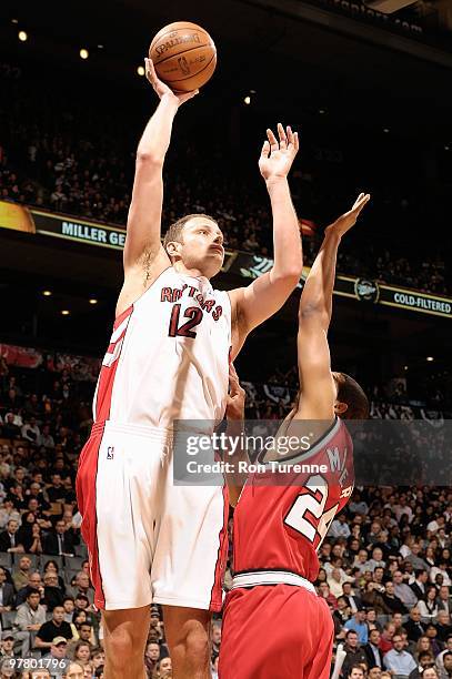Rasho Nesterovic of the Toronto Raptors puts up a shot against the Portland Trail Blazers during the game on February 24, 2010 at Air Canada Centre...