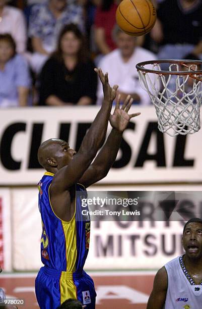 Mark Davis for Adelaide shoots a goal in the match between the Adelaide 36ers and the Townsville Crocodiles played at the Clipsal Powerhouse in...