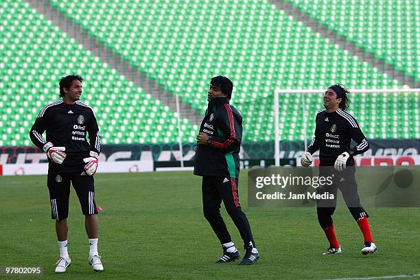 Mexico's players Luis Mitchel and Guillermo Ochoa with goalkeeper trainer Alberto Aguilar during a training session at Territorio Santos Modelo on...