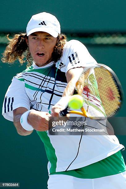 Juan Monaco of Argentina returns a shot to Guillermo Garcia-Lopez during the BNP Paribas Open on March 17, 2010 at the Indian Wells Tennis Garden in...