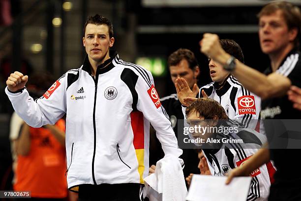 Dominik Klein of Germany and team mates celebrate during the international handball friendly match between Germany and Switzerland at the Porsche...