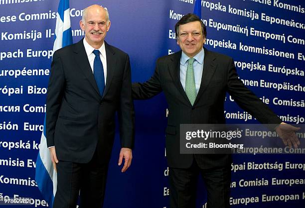 Jose Manuel Barroso, president of the European Commission, right, arrives with George Papandreou, Greece's prime minister, for a news conference at...