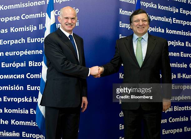 Jose Manuel Barroso, president of the European Commission, right, greets George Papandreou, Greece's prime minister, before a news conference at the...