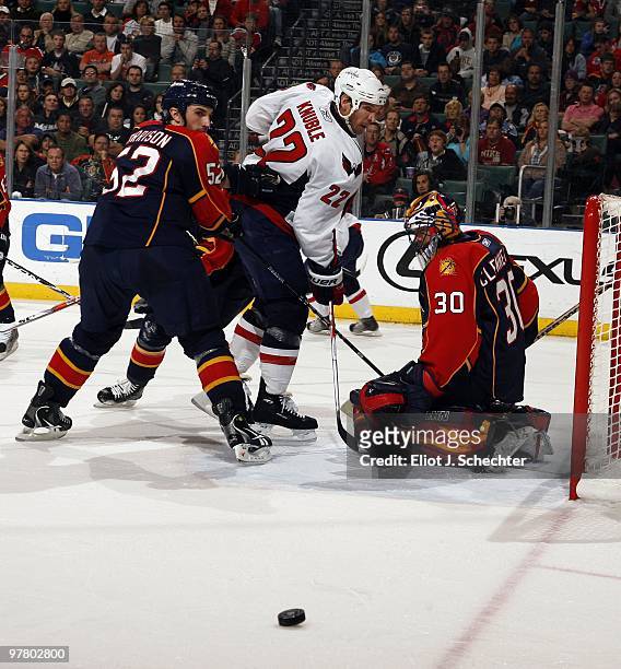 Goaltender Scott Clemmensen of the Florida Panthers defends the net with the help of teammate Jason Garrison against Mike Knuble of the Washington...