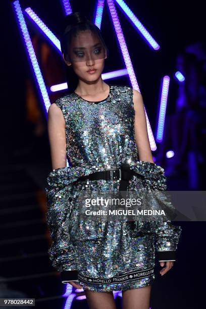 Model presents a creation by Frankie Morello fashion house during the men and women's spring/summer 2019 collection fashion show in Milan, on June...