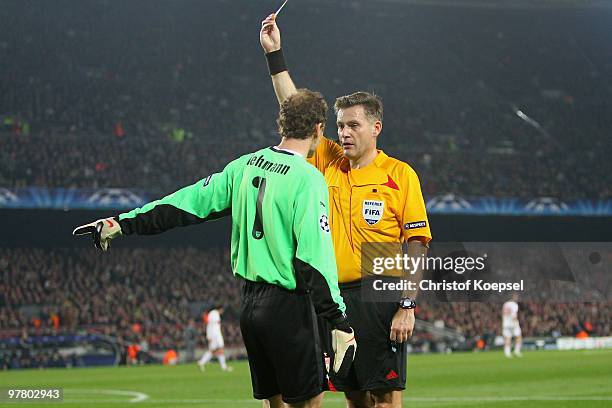 Referee Alain Hamer of Luxemburg shows Jens Lehmann of Stuttgart the yellow card during the UEFA Champions League round of sixteen second leg match...