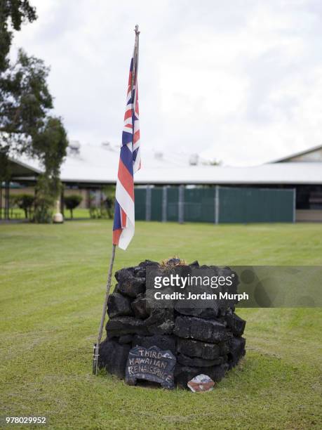 Monument made of magma on the Volcano Golf Course next to the Halema'uma'u crater from the erupting Kilauea volcano in the background. The latest...