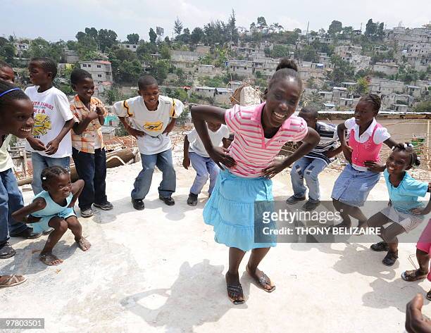 Haitian teacher works with children traumatized by the January 12 earthquke on March 17 2010 under a tent in Petion-ville, Haiti. Haiti has unveiled...