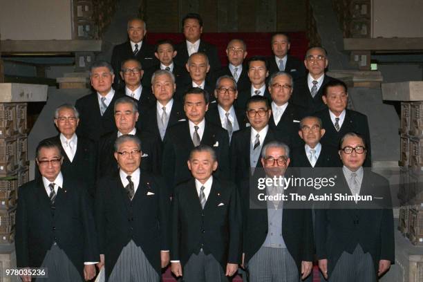 Prime Minister Noboru Takeshita and his new cabinet members pose for photographs at the prime minister's official residence on December 27, 1988 in...