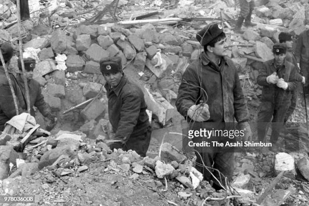 Soldiers continue searching operation in the rubble after a strong earthquake hit the region on December 17, 1988 in Spitak, Armenia, Soviet Union.