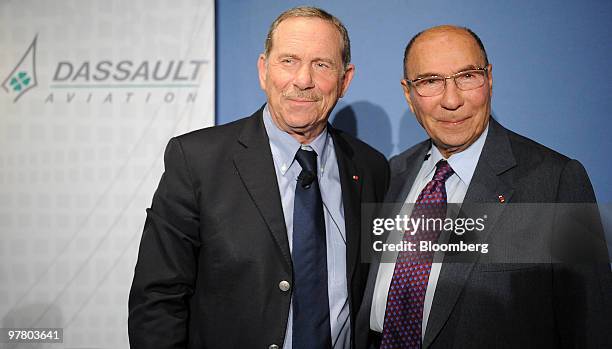 Charles Edelstenne, chairman and chief executive officer of Dassault Aviation SA, left, and Serge Dassault, honorary chairman, pose for photographers...