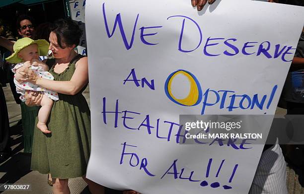 Supporters of healthcare reform hold a rally outside the Saban Free Clinic on the eve of this weekends historic vote on the reform of the US health...