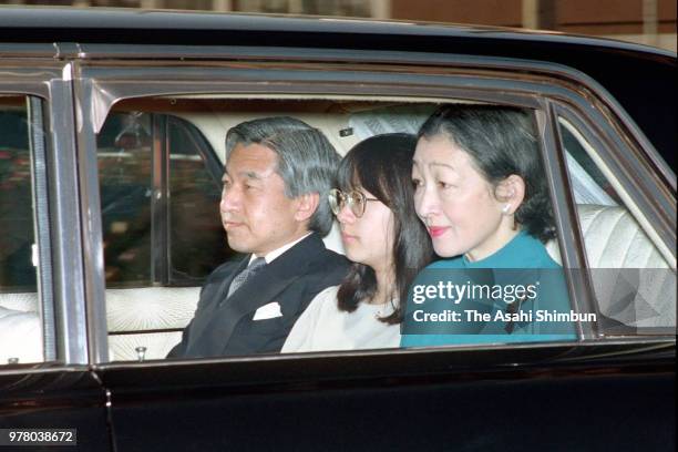 Crown Prince Akihito, Princess Sayako and Crown Princess Michiko are seen on arrival at the Imperial Palace to see Emperor Hirohito on December 23,...