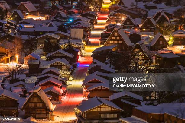 high angle view of illuminated town, shirakawa, gifu, japan - shirakawa go stock pictures, royalty-free photos & images