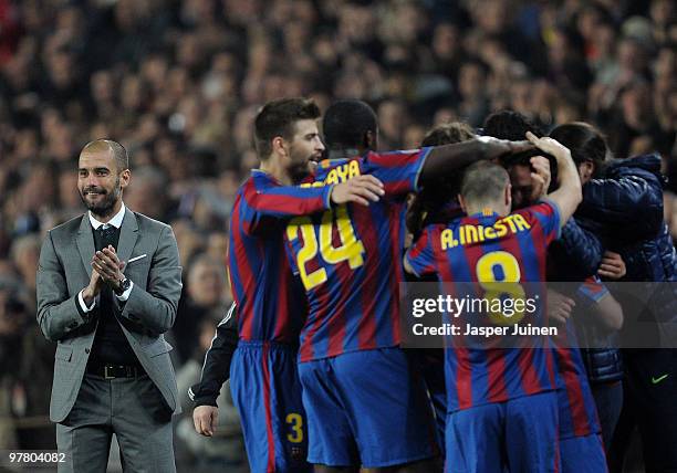 Head coach Josep Guardiola of FC Barcelona celebrates alongside his players after Lionel Messi scored Barcelona's third goal during the UEFA...