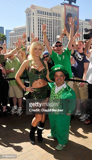 Television personality and model Holly Madison and O'Sheas' Lucky Leprechaun, Brian Thomas, pose for a post-game picture after Madison beat Thomas in...