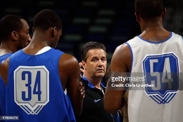 Head coach John Calipari of the Kentucky Wildcats talks with his players during practice before playing in the first round of the 2010 NCAA men�s...