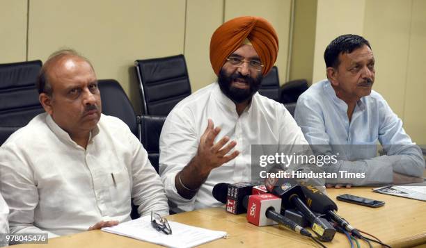 Opposition leader Vijender Gupta , BJP MLA Manjinder Singh Sirsa and Jagdish Pradhan address a press conference on the sixth day of their sit-in...