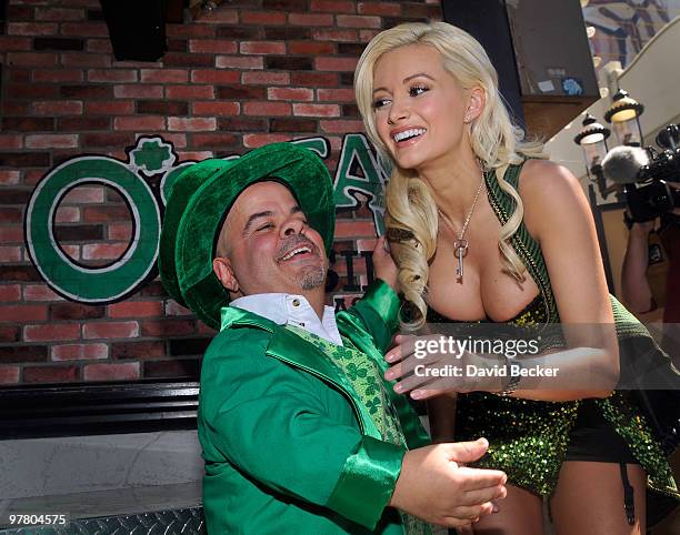 Sheas' Lucky Leprechaun, Brian Thomas and television personality and model Holly Madison, pose for a post-game picture after Madison beat Thomas in a...