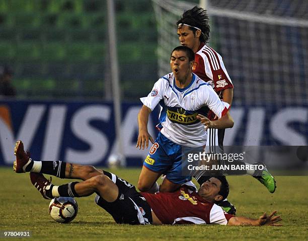 Venezuelan Caracas FC player Franklin Lucena vies for the ball with Francisco Silva of Chilean Universidad Catolica during their Copa Libertadores...