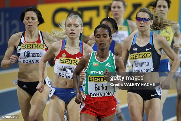 Ethiopia's Gelete Burka and Russia's Anna Alminova compete in the women's first round 1500m at the 2010 IAAF World Indoor Athletics Championships at...