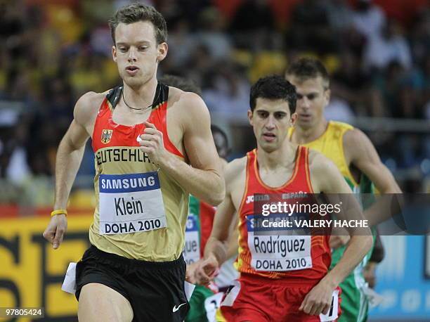 Germany's Christian Klein and Spain's Alvaro Rodriguez compete in the men's first round 1500m at the 2010 IAAF World Indoor Athletics Championships...