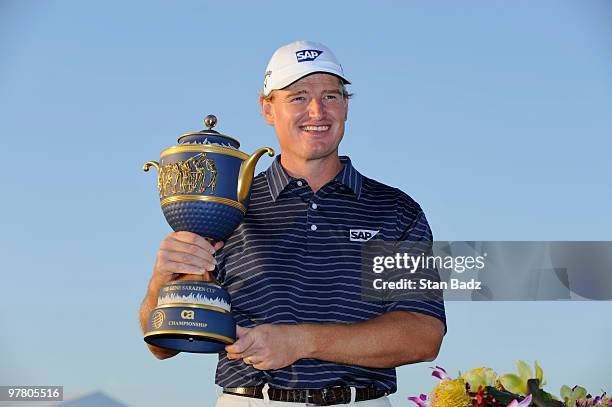 Ernie Els of South Africa hold the winner's trophy during the final round of the World Golf Championships-CA Championship at Doral Golf Resort and...